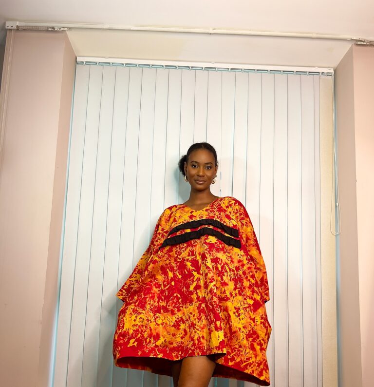 Orange kaftan with black ruffle details