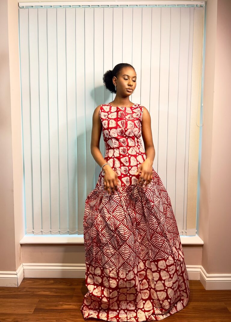 Long, flowy sleeveless dress in a mixture of red and white colors